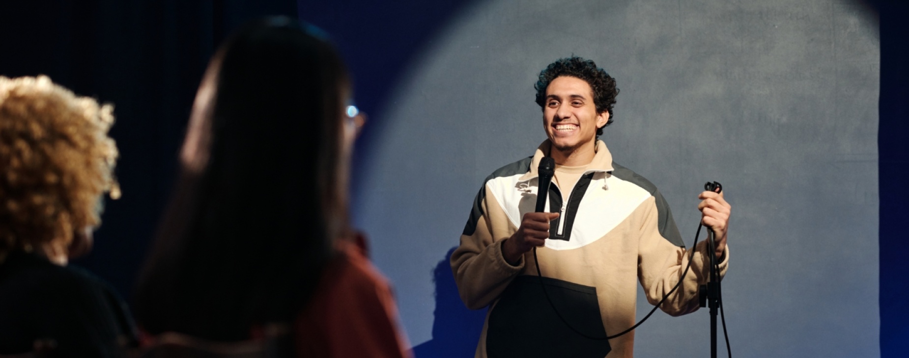 young-male-comedian-talking-to-audience